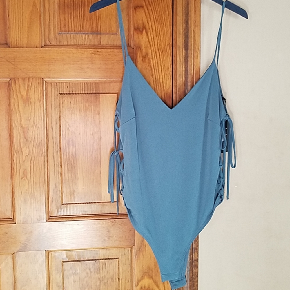 Low back, laced up sides, button bottom bodysuit